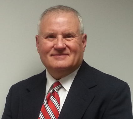 Smiling man in suit and striped tie