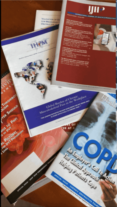 Stack of healthcare reports and brochures